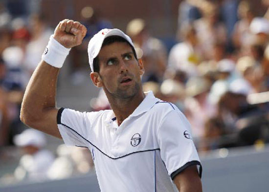 Novak Djokovic of Serbia celebrates winning a point during his semi-final match against Roger Federer of Switzerland at the U.S. Open tennis tournament in New York
(Reuters)