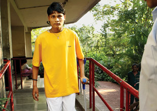 13/7 victim Dinesh Majhi walks