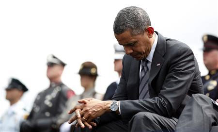 US President Barack Obama waits to speak during the National Peace Officers Memorial Service on Capitol Hill in Washington.