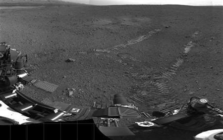 Handout image courtesy of NASA shows tracks left by the Curiosity rover on Mars August 22, 2012.
Credit: Reuters/NASA/JPL/Handout
