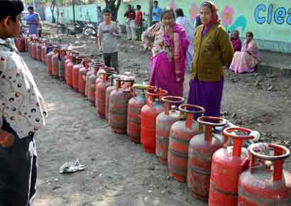 People stand in queue for LPG cylinders