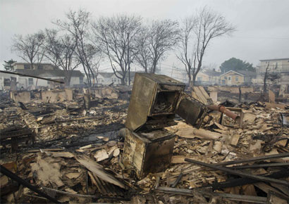 Homes devastated by fire and the effects of Hurricane Sandy at the Breezy Point section of the Queens borough of New York October 30, 2012