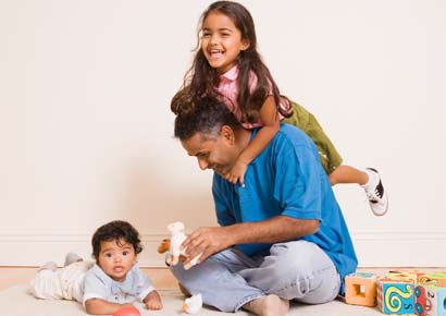 A father plays with his children