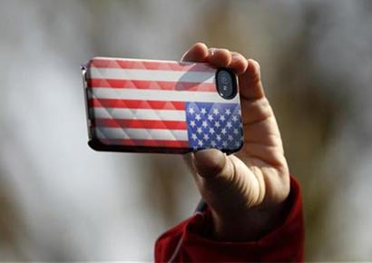 An Obama supporter records the moment as US Vice President Joe Biden speaks during a campaign rally in Sterling, Virginia