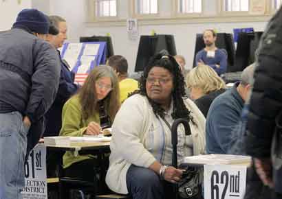A voter waits for her turn to vote in the US presidential election at a displaced polling center in the Coney Island section of Brooklyn, New York