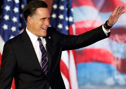 Mitt Romney waves before delivering his concession speech during his election night rally in Boston, Massachusetts on November 7, 2012