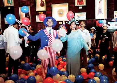 A group of the US poll watchers celebrate President Barack Obama's victory at a function hosted by the American Consulate in Lower Parel on Wednesday.