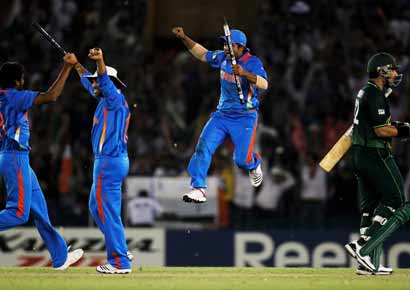 The Indian team celebrate victory over Pakistan during the 2011 ICC World Cup second Semi-Final
