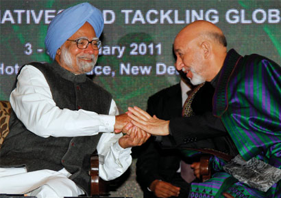 Afghanistan president Hamid Karzai (R) with prime minister Manmohan Singh at the 11th Delhi Sustainable Development Summit 2011 on Thursday, February 3, 2011
