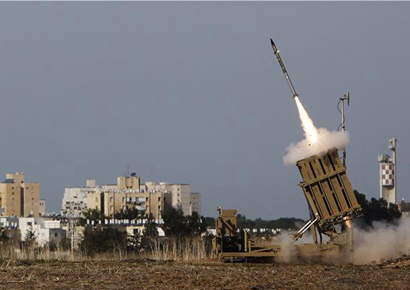 An Iron Dome launcher fires an interceptor rocket in the southern city of Ashdod in Israel on Friday.