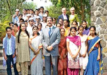 Anand Mahindra (centre), chairman and managing director, Mahindra Group, along with the faculty and staff members of the UWC Mahindra College.