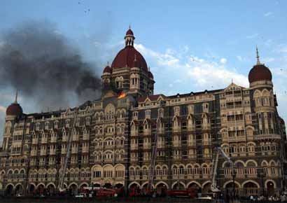File photo of flames rushing out of the Taj Mahal Hotel in Mumbai on November 27, 2008. Up to 166 people were killed and around 100 more wounded in coordinated attacks by gunmen in Mumbai