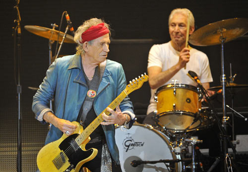 Keith Richards (L) and Charlie Watts performs with the Rolling Stones at the O2 Arena in London November 25, 2012. The Stones took to the stage on Sunday after a five-year hiatus to celebrate the golden jubilee of one of the most successful and enduring bands in rock and roll history. Now in their mid-60s to early 70s, lead singer Mick Jagger, guitarists Richards and Ronnie Wood and drummer Watts were joined by former members Bill Wyman and Mick Taylor for concerts in London and the United States. 