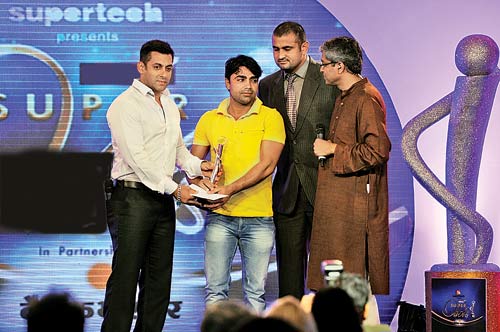 Salman Khan giving out a trophy at an award function