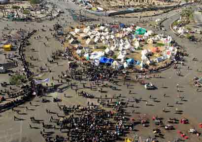 Protesters chant anti-government slogans in Tahrir Square in Cairo on Tuesday.