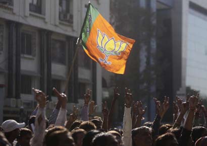 Supporters of BJP celebrate the victory of their party in Gujarat state assembly elections on Thursday in Ahmedabad.