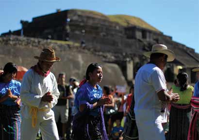 Pipil Mayans perform a dance during a ceremony at the Maya archeological site of Tazumal in Santa Ana