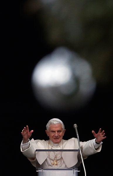Pope Benedict XVI leads his Angelus prayer from the window of his private apartments in Saint Peter's Square at the Vatican
Photo by Alessandro Bianchi
(Reuters)