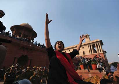 People protest near India Gate against the rape