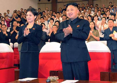 North Korea supreme commander Kim Jong Un enjoys a demonstration of the newly organised Moranbong band at an event in Pyongyang on July 6, 2012. The picture was taken by the Korean Central News Agency and released on July 9.