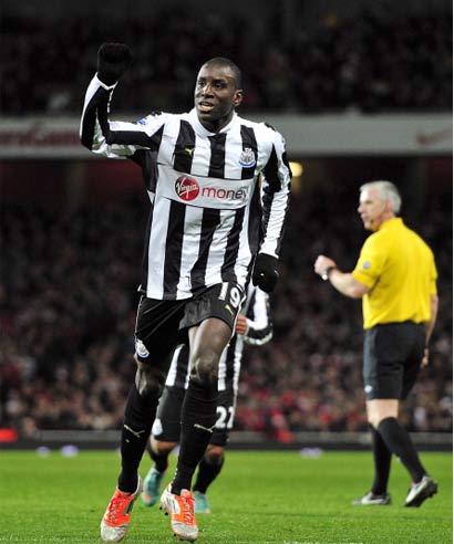 Newcastle United's French-born Senegalese striker Demba Ba celebrates scoring their first goal from a free-kick during the English Premier League football match between Arsenal and Newcastle United at The Emirates Stadium in north London, England on December 29, 2012.