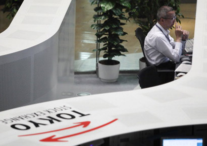 A Nikkei employee works on the trading floor of the Tokyo Stock Exchange in Tokyo, Japan.
