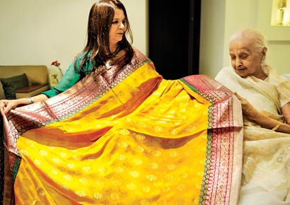 Meena Dholakia (left) is passionate about creating new saris from old ones. Her mother-in-law, Kusum Dholakia is happy her old saris are getting a new life Meena Dholakia (left) is passionate about creating new saris from old ones. Her mother-in-law, Kusum Dholakia is happy her old saris are getting a new life