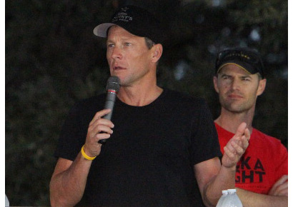 Cyclist Lance Armstrong addresses the crowd before the beginning of the Team Livestrong Challenge bike ride in Austin, Texas on October 21, 2012.