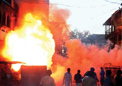 Mobs set houses and shops on fire in Dhule on Sunday following a spar over cricket match that led to a riot