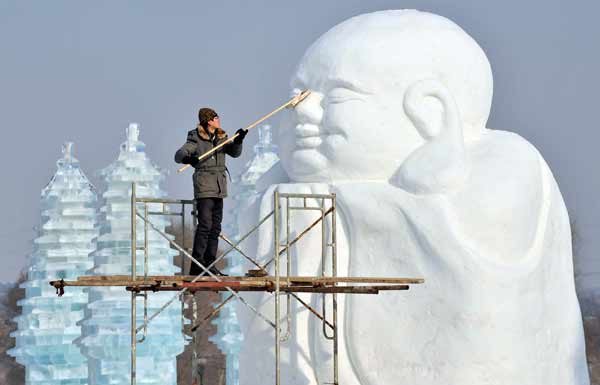 A man polishes a snow sculpture in preparation for Shenyang International Ice and Snow Festival, Liaoning province, January 8, 2013. The festival kicks off on January 10, local media reported.
(Reuters)