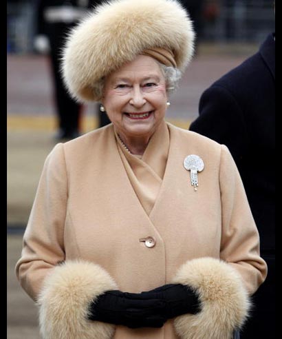 Queen Elizabeth II arrives to unveil a memorial to the Queen Mother on the Mall in London on February 24, 2009. The memorial stands in front of a statue of her late husband King George VI a short way from the Queen Mother's former homes Buckingham Palace and Clarence House.