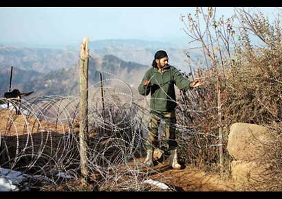 A soldier works near the Line of Control after reported ceasefire violation, in Mendhar, Poonch, in Jammu & Kashmir on Wednesday.