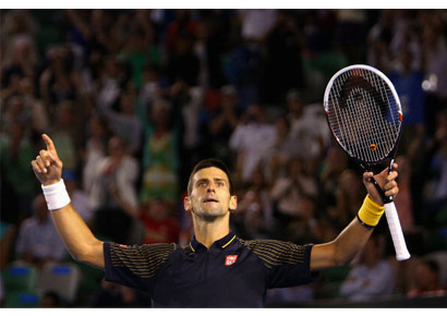Novak Djokovic of Serbia celebrates after winning his fourth round match against Stanislas Wawrinka of Switzerland during day seven of the 2013 Australian Open at Melbourne Park on Sunday.