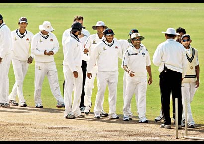 Mumbai players celebrate after securing the first innings lead over Services at Palam in New Delhi on Monday.
