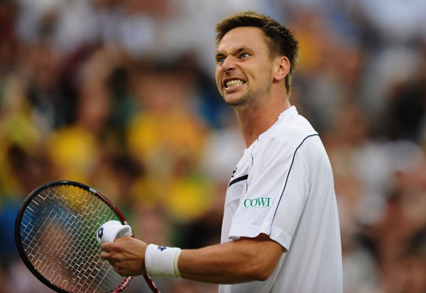On Friday, World No. 3 Andy Murray defied all odds to beat second-seed Roger Federer in the men's singles semifinal of the Australian Open on Friday. The Brit stayed put to win 6-4, 6-7, 6-3, 6-7, 6-2 and register his first Grand Slam win against the Swiss ace. Though it cannot be called an upset in the classical sense, it leaves an aftertaste of one. Here are the 10 most real 'upsetting' Grand Slam matches.
Soderling slays the King of Clay
Robin Soderling ended Rafael Nadal's reign at the Roland Garros, if only for a year, by beating him 6-2 6-7(2) 6-4 7-6(2) in the fourth round of the 2009 French Open. The Swede is the first and so far the only player to defeat Nadal at French Open.
(Getty Images) Robin Soderling of Sweden celebrates victory during his second round match against Lleyton Hewitt of Australia on Day 4 of the 2011 Wimbledon on June 23, 2011.