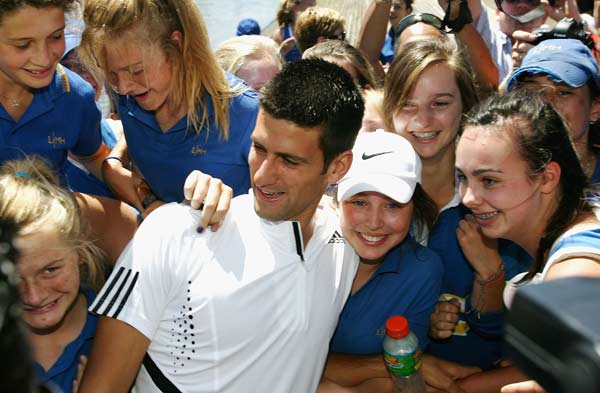 Djoko arrives in style
The year was 2008 and Novak Djokovic was yet to win a major. And the Serb finally ended his title drought by getting the better of two-time defending champion Roger Federer in straight sets — 7-5 6-3 7-6(5) — in the Australian Open semifinal. For the record, he beat Jo-Wilfried Tsonga in the final.
(Getty Images) Novak Djokovic is hugged by fans following his victory at the 2008 Australian Open on January 28, 2008.
