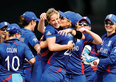 England skipper Charlotte Edwards embraces pacer Katherine Brunt, who dismissed India captain Mithali Raj