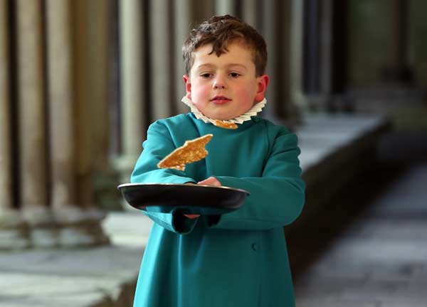 A probationers from Salisbury Cathedral Choir flips a pancake at Salisbury Cathedral.
Photo by: Matt Cardy
(Getty Images)