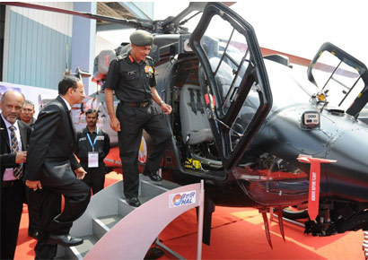 Hindustan Aeronautics Limited Chaiman Dr R K Tyagi hands over Rudra helicopter to Lt Gen Narendra Singh during handing over ceremony at Aero india on Friday. Hindustan Aeronautics Limited Chaiman Dr R K Tyagi hands over Rudra helicopter to Lt Gen Narendra Singh during handing over ceremony at Aero india on Friday.