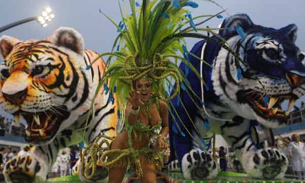 As Lent nears, the carnival has come to town in Brazil, Bolivia and other South American countries. Here's a look at the best pictures from the 2013 South American carnival.
What is the carnival all about?
The carnival is a festival that is celebrated before Lent and falls generally during the month of February.
Also read: The samba queens are set to battle
A reveller from the Imperio de Casa verde Samba School takes part in a carnival at Anhembi Sambadrome in Sao Paulo.
(Reuters)
