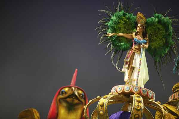A reveller from the Imperio de Casa verde Samba School takes part in a carnival at Anhembi Sambadrome in Sao Paulo.
Samba fever grips Brazil
What happens during the carnival?
Floats are generally put up and people participate in a public celebration which has elements of a masquerade party where people dress up and celebrate the days before the season of Lent—a period of 40 days during which Christian, Catholics in particular observe fasting and penance before Holy Week which culminates in Easter which marks the resurrection of Jesus Christ.
(Reuters)