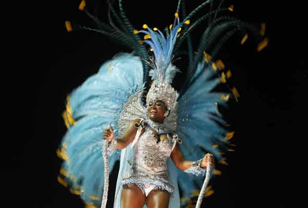A reveller from Paraiso do Tuiuti samba school dances atop a float during the second night of the A Group annual Carnival parade in Rio de Janeiro`s Sambadrome.
(Reuters)