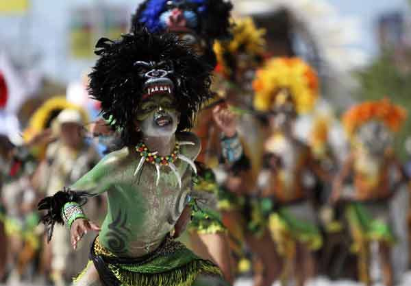 A reveller performs during the "Battle of the Flowers" parade as part of Carnival celebrations in Barranquilla.
(Reuters)