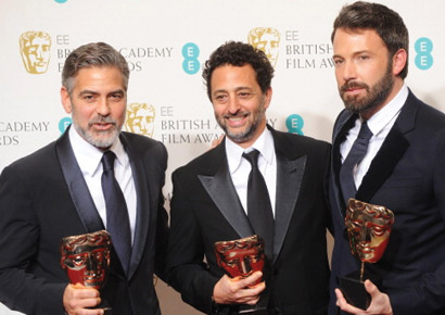 George Clooney, Grant Heslov and Ben Affleck, winners of the Best Film award for <i>Argo</i>, pose in the press room at the EE British Academy Film Awards at The Royal Opera House on February 10, 2013 in London, England. 