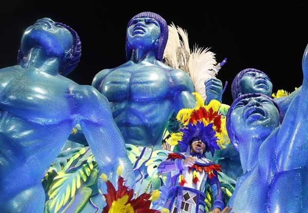 From Rio de Janeiro's Carnival parade to an Alpine Ski Resort valley in Sochi, here are the best pictures from February 11, 2013.
A reveller of Portela samba school participates in the annual Carnival parade in Rio de Janeiro's Sambadrome on Monday.
Photo by: Pilar Olivares (Reuters)
(Reuters)