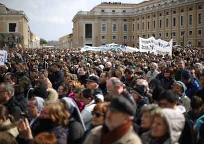 The faithful listen as Pope Benedict XVI delivers his last Angelus Blessing in Saint Peter's Square on February 24 in Vatican City, Vatican. The Pontiff will hold his last weekly public audience on February 27, 2013, before he retires the following day. 