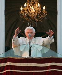 Pope Benedict XVI waves to pilgrims, for the last time as head of the Catholic Church, from the window of Castel Gandolfo where he will start his retirement on Thursday in Rome, Italy. 