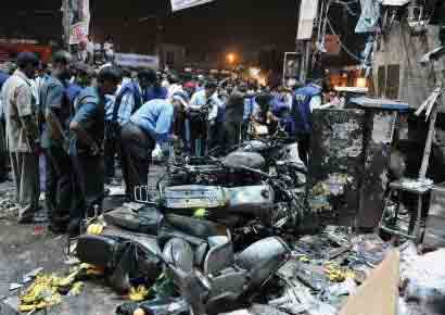 A file photo of investigators at the site of a bomb blast at Dilshuknagar in Hyderabad on February 21, 2013.