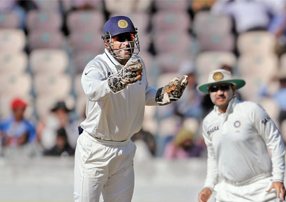 MS Dhoni is all smiles after David Warner is clean bowled by R Ashwin in Hyderabad on Monday