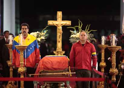 Venezuela's Vice-President Nicolas Maduro (L) and National Assembly President Diosdado Cabello stand guard next to the coffin of late Venezuelan President Hugo Chavez during a wake at the military academy in Caracas on Thursday.